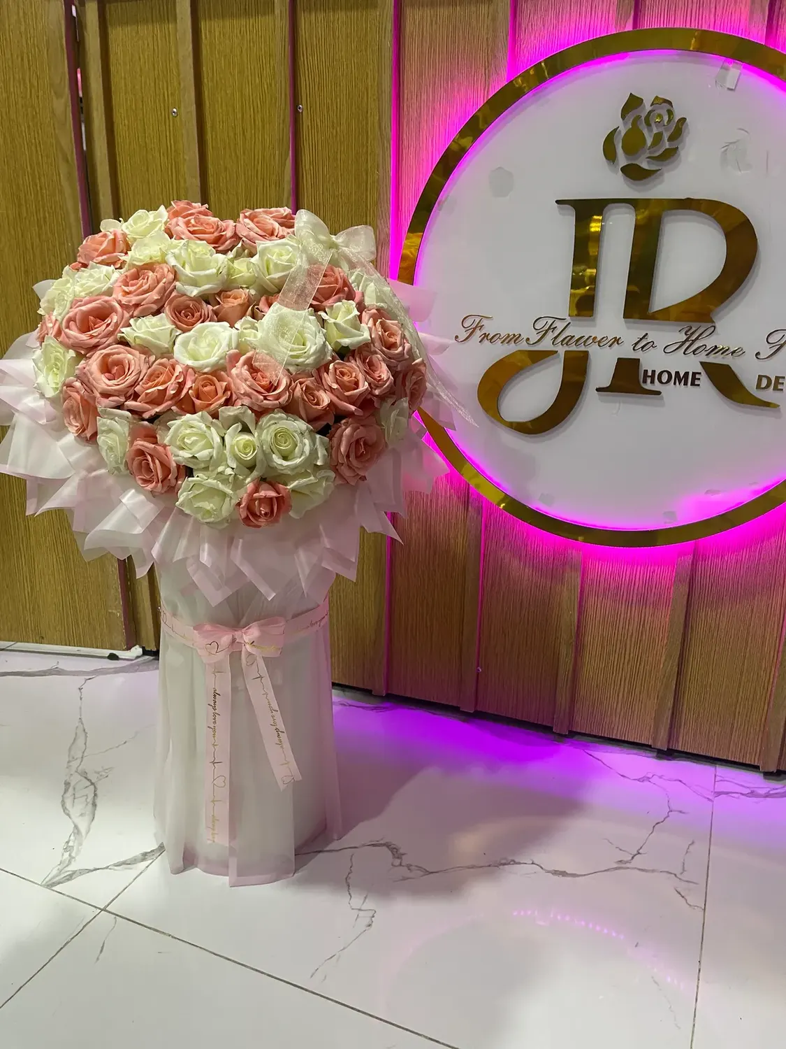 Tall blush rose column by Joury Flowers