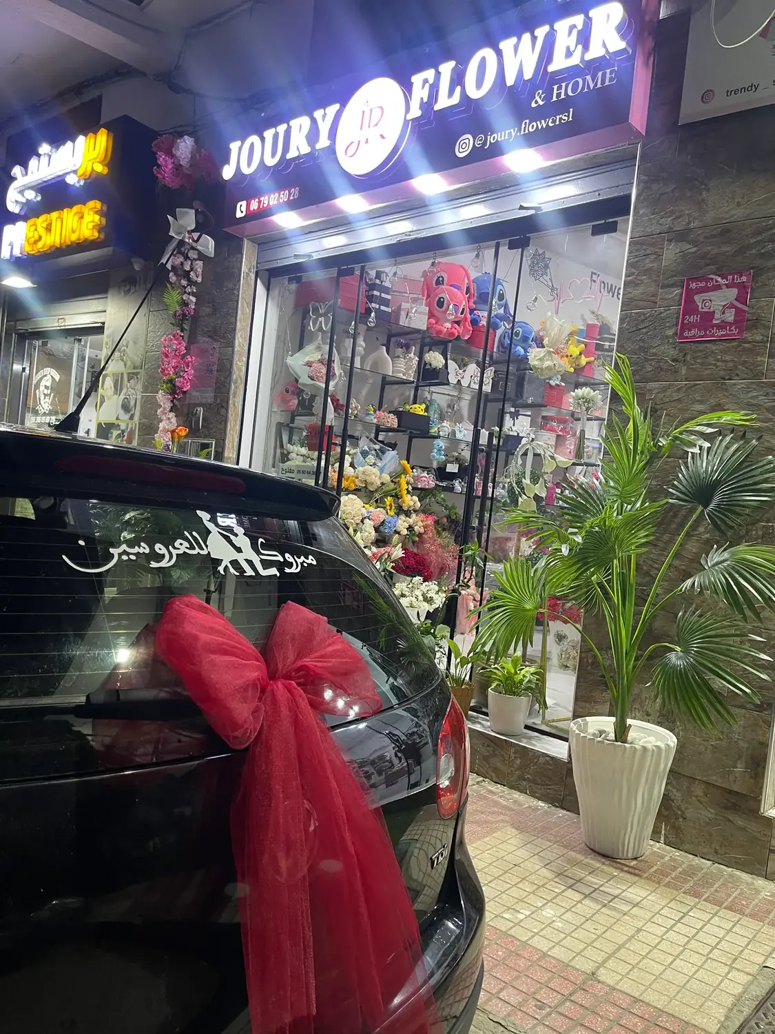 Red bow car decoration by Joury Flowers